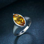 close up of marquise citrine solitaire ring in rhodium over sterling silver