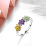 citrine amethyst peridot and white zircon ring in rhodium over sterling silver shown in a lifestyle photo