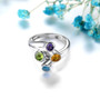close up of unique multi gemstone bypass ring in rhodium over sterling silver