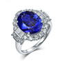 tanzanite and diamond halo ring in 18k white gold