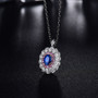 sapphire and diamond triple halo 18k white gold convertible ring necklace shown in a lifestyle photo