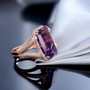 side view of amethyst and diamond cocktail ring in 14k rose gold