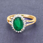 lifestyle view zambian emerald green gemstone ring in solid 14k yellow gold