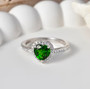 chrome diopside and moissanite heart halo ring in rhodium over sterling silver shown in a lifestyle photo