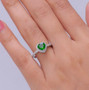 chrome diopside and moissanite heart shaped halo ring in rhodium over sterling silver on hand model