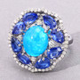 angled view of blue opal pear shaped kyanite and diamond ring in rhodium over sterling silver