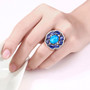 oversized blue opal and kyanite statement ring worn on hand in rhodium plated sterling silver