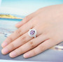 rose de france amethyst and white zircon double halo ring in 18k rose gold over sterling silver worn on a hand