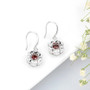 full view of dancing garnet and white zircon dangle earrings in rhodium over sterling silver