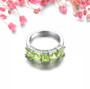 close up of peridot band ring in rhodium over sterling silver