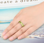peridot band ring in rhodium over sterling silver worn on a hand