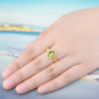 natural peridot chain link solitaire ring in 18k yellow gold over sterling silver worn around the neck