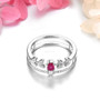 close up of ruby and white zircon double band ring in rhodium over sterling silver