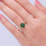 chrome diopside oval solitaire openwork 10k yellow gold ring worn on a hand