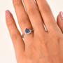 tanzanite and lab diamond trillion halo openwork ring in 10k yellow gold on hand model