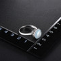 blue chalcedony solitaire ring in rhodium over sterling silver shown for size comparison
