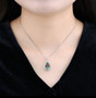 close up of green fluorite and white zircon pear pendant necklace in rhodium over sterling silver