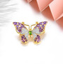 multi gemstone butterfly brooch in 18k yellow gold over sterling silver shown in a lifestyle photo