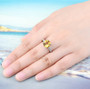 natural citrine and white zircon ring in rhodium over 925 sterling silver worn on a hand