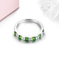 side view of chrome diopside and white zircon band ring in rhodium over sterling silver