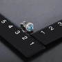 swiss blue topaz and white zircon round halo stud earrings in rhodium over sterling silver