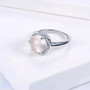 full view of rose quartz and white zircon halo ring in rhodium over sterling silver