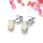 full view of oval 6x4mm natural faceted opal stud earrings in rhodium over sterling silver