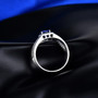 close up of mens blue sapphire and diamond 14k white gold ring