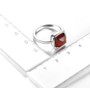 hessonite garnet cabochon sugar loaf solitaire rhodium over sterling silver ring shown for size comparison