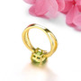 close up of peridot and white zircon split shank ring in 18k yellow gold over sterling silver
