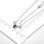 chrome diopside solitaire deer necklace in rhodium over sterling silver shown for size comparison