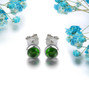 chrome diopside round cabochon stud earrings in rhodium over sterling silver shown in a lifestyle photo