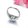 full view of electric swiss blue topaz and zircon flower cluster ring in rhodium over sterling silver