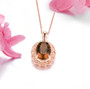 close up of cognac quartz 18k rose gold over sterling silver oval pendant necklace