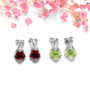 full view of 6mm trillion garnet stud earrings in rhodium over sterling silver