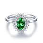 tsavorite garnet and diamond halo 14k white gold ring flat lay