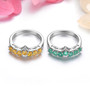 spessartine garnet or emerald stacking band ring in rhodium over sterling silver shown in a lifestyle photo