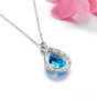 back view of large blue topaz pear halo pendant necklace in rhodium over sterling silver