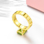 close up of peridot and emerald cut solitaire 18k yellow gold over sterling silver ring