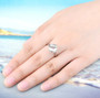 prasiolite cushion cut solitaire ring in rhodium over sterling silver worn on a hand
