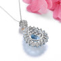 back view of sky blue topaz white topaz and citrine pendant necklace in rhodium over sterling silver