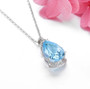 side view of sky blue topaz and white zircon pear necklace in rhodium over sterling silver