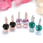rose de france amethyst and white zircon dangle earrings in 18k rose gold over sterling silver shown in a lifestyle photo