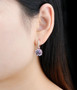 rose de france amethyst and white zircon dangle earrings in 18k rose gold over sterling silver worn on the ear