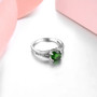 side view of round chrome diopside and white zircon center design ring in rhodium over sterling silver