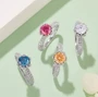 moissanite 6 5mm round womens wedding ring in rhodium over sterling silver shown in a lifestyle photo