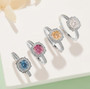 moissanite brilliance round halo ring in rhodium over sterling silver shown in a lifestyle photo