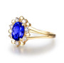 side view of tanzanite and diamond halo 14k yellow gold ring
