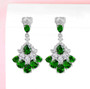elegant chrome diopside and white zircon dangle earrings in rhodium over sterling silver shown in a lifestyle photo