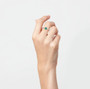 green chalcedony and diamond 14k white gold wedding ring worn on a hand